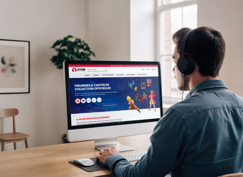 Présentation du site e-commerce Atom Collectors sur ordinateur, développé pour les passionnés de figurines et de cartes à collectionner.